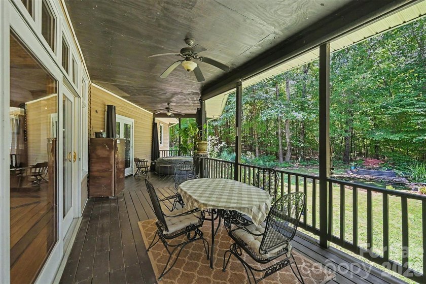 Tucked away on over 4 private wooded acres in the desirable - photo 29