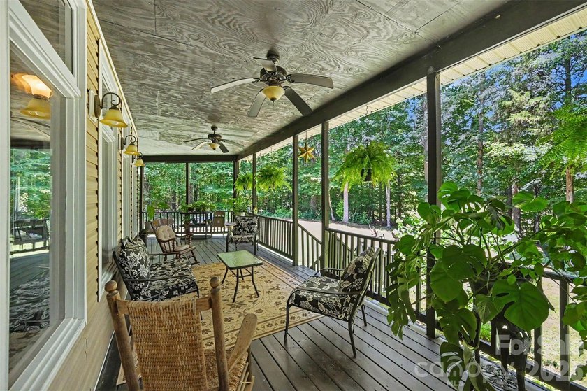 Tucked away on over 4 private wooded acres in the desirable - photo 31