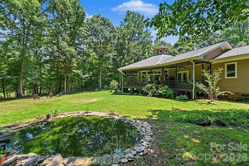Tucked away on over 4 private wooded acres in the desirable - photo 34