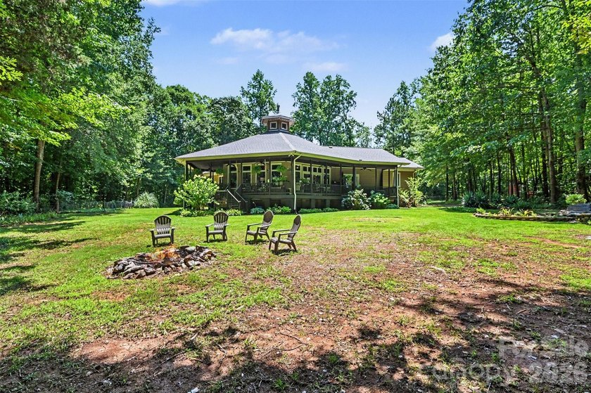 Tucked away on over 4 private wooded acres in the desirable - photo 36