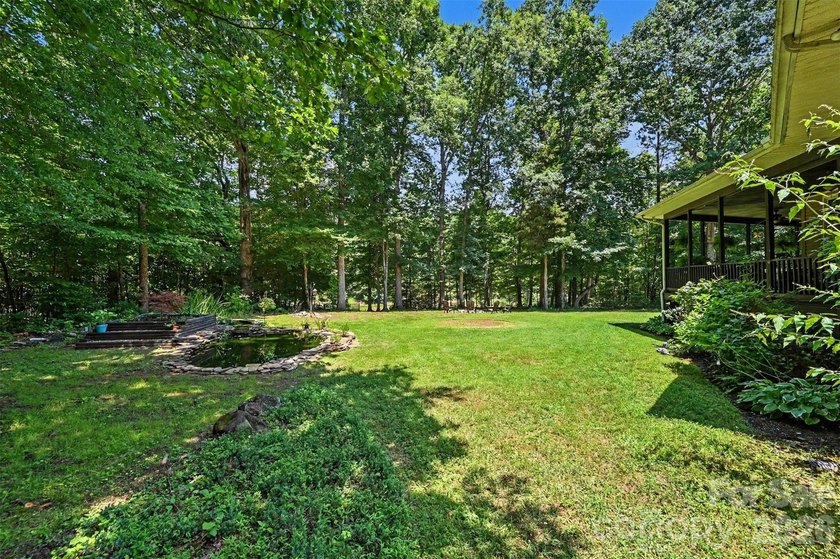 Tucked away on over 4 private wooded acres in the desirable - photo 37