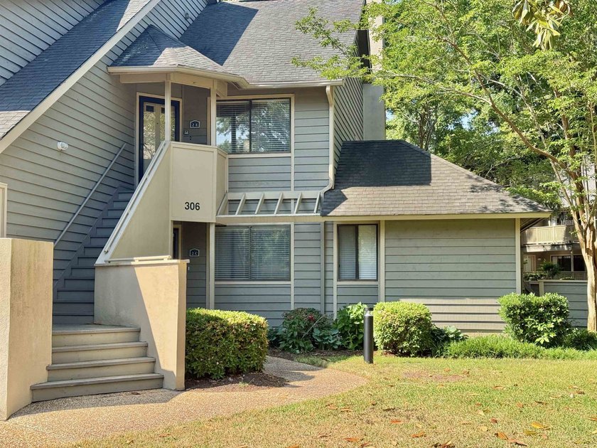 Updated and attractive second-floor end-unit villa featuring two - photo 2