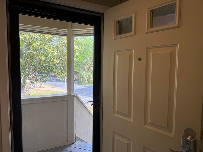 Updated and attractive second-floor end-unit villa featuring two - photo 3