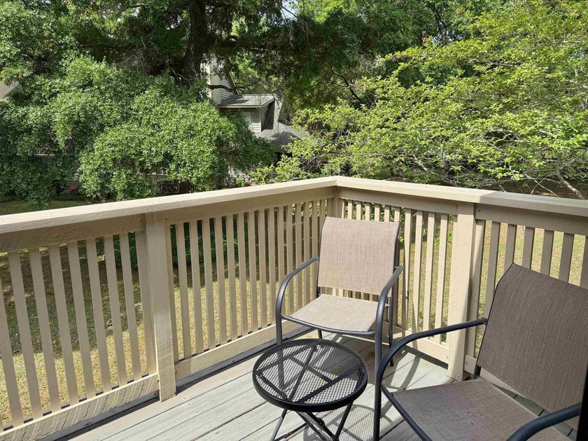 Updated and attractive second-floor end-unit villa featuring two - photo 9