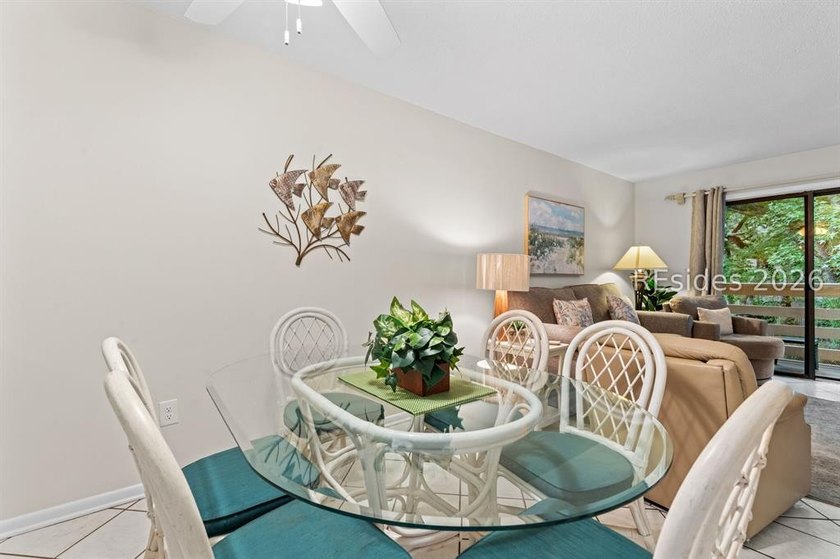 Tucked among mature landscaping in the highly desirable gated - photo 7