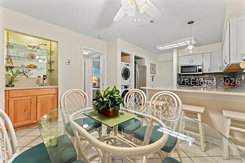 Tucked among mature landscaping in the highly desirable gated - photo 8
