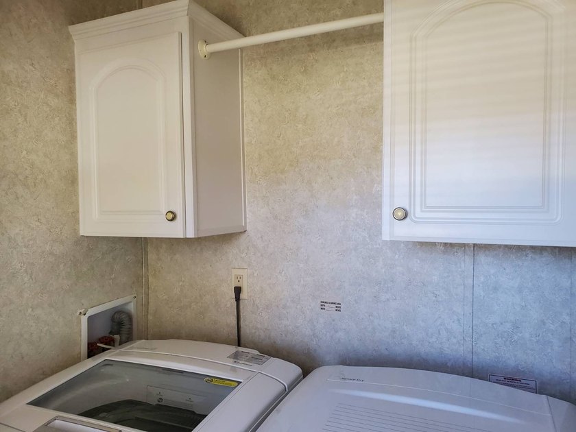 THIS HOME IS ON LEASED LAND WITH A MONTHLY LOT RENT OF $613 AND - photo 22