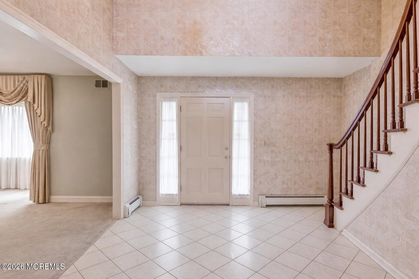 Welcome to this spacious 6-bedroom, 4.5-bath home offering over - photo 6