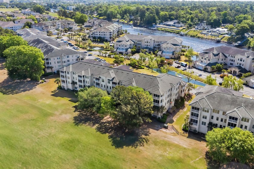 Beautifully positioned within Barefoot Resort &amp; Golf, this - photo 2