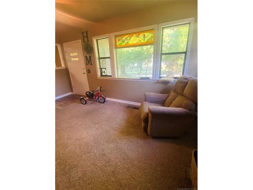 Located in Cleveland, Oklahoma, this charming residence is - photo 4