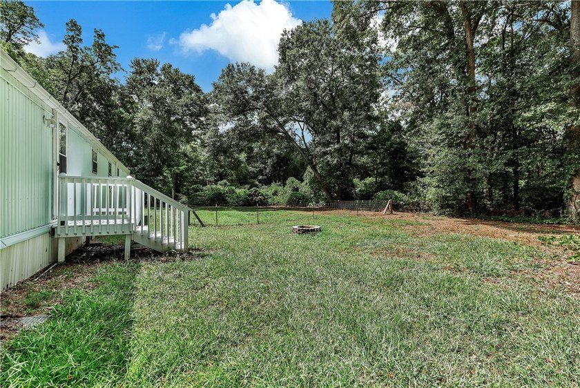 Single Wide Mobile home located on a 1.28-acre level lot. Brand - photo 50