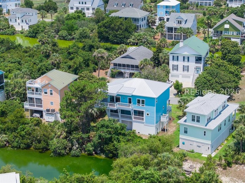 Welcome to 5 Tradewind Lane, a stunning coastal retreat in the - photo 4