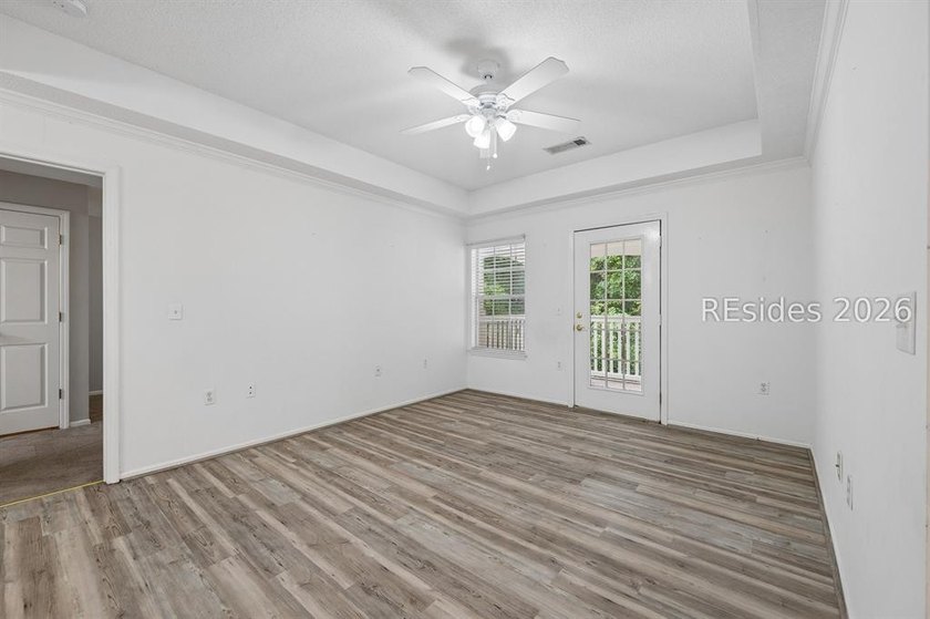 Enjoy wooded views from this second-floor condominium in The - photo 3