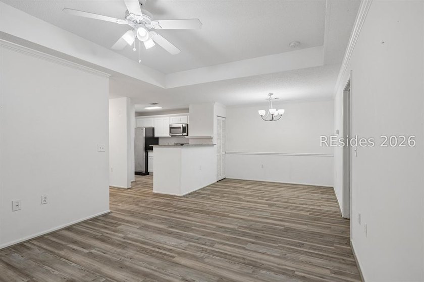 Enjoy wooded views from this second-floor condominium in The - photo 5