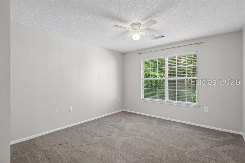 Enjoy wooded views from this second-floor condominium in The - photo 9