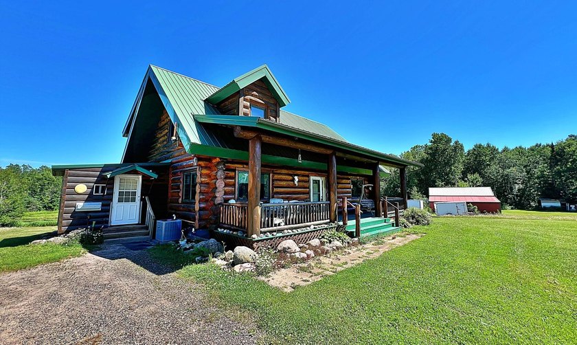 Authentic log cabin retreat on 80 picturesque acres featuring a - photo 2