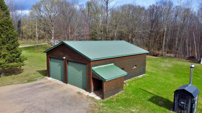 Authentic log cabin retreat on 80 picturesque acres featuring a - photo 3