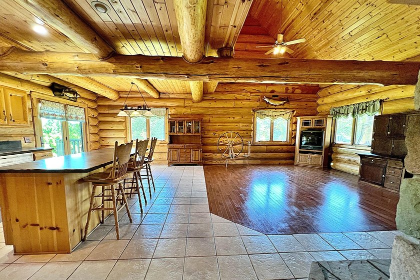 Authentic log cabin retreat on 80 picturesque acres featuring a - photo 7