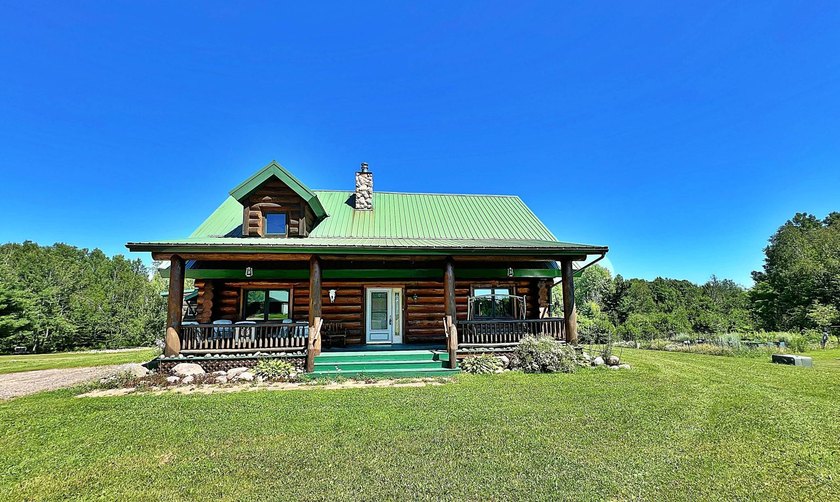 Authentic log cabin retreat on 80 picturesque acres featuring a - photo 8