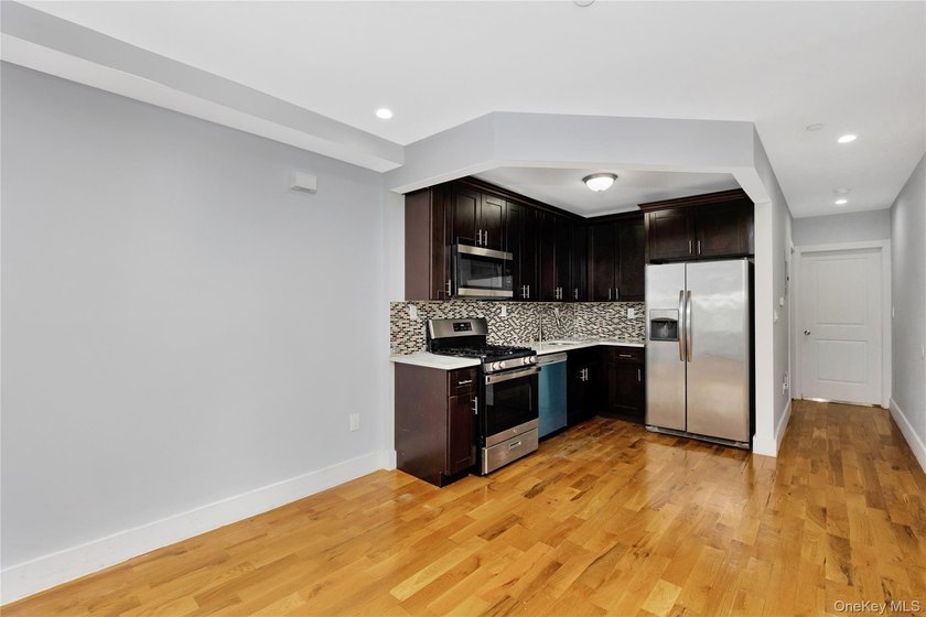 Built in 2021, this legal two-family brick duplex offers a rare - photo 5