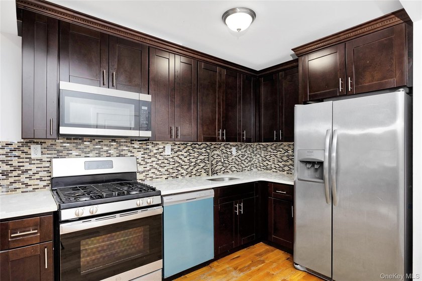 Built in 2021, this legal two-family brick duplex offers a rare - photo 6