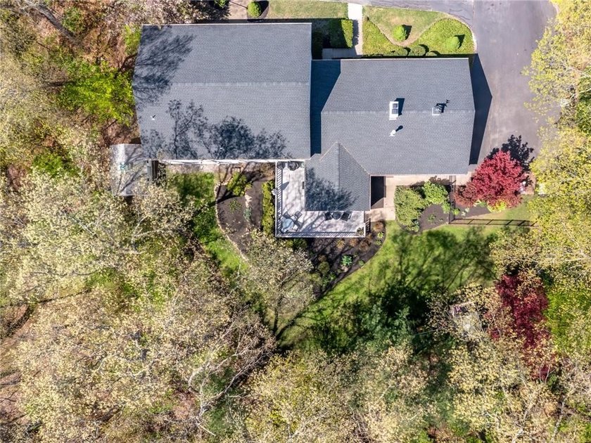A circular driveway welcomes you to this elegant Colonial set on - photo 4