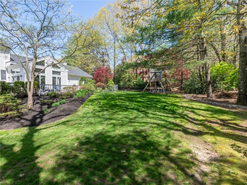A circular driveway welcomes you to this elegant Colonial set on - photo 5