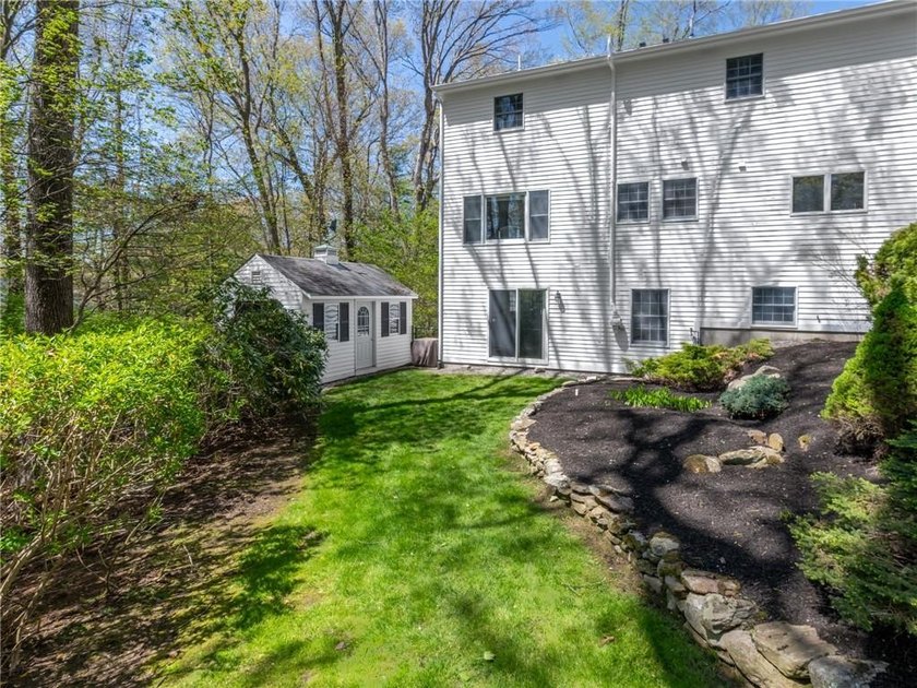 A circular driveway welcomes you to this elegant Colonial set on - photo 9