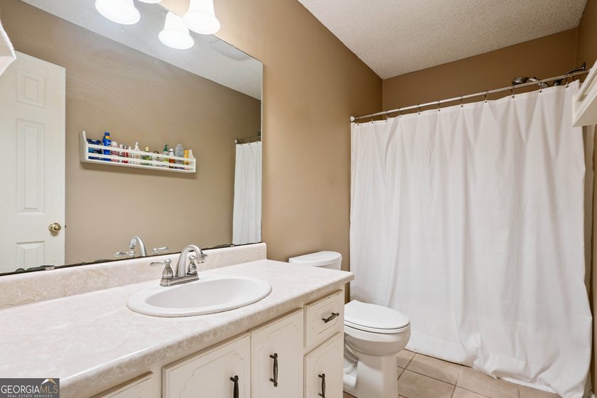 Welcome home to this charming 3-bedroom, 2-bath cottage-style - photo 18