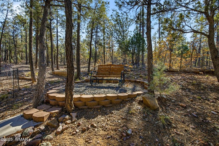 Nestled on a premium, private lot surrounded by towering pines - photo 26