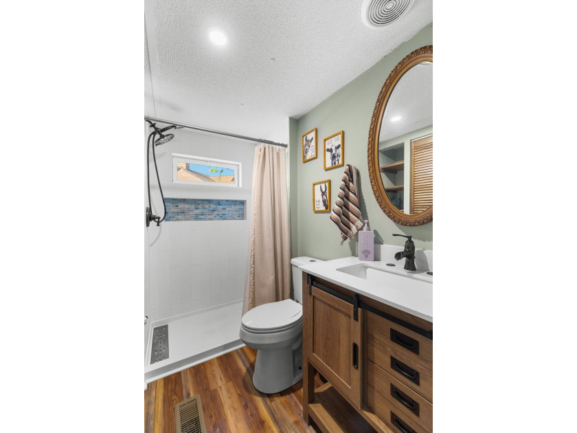 Welcome home to this charming, fully updated lake retreat on - photo 21