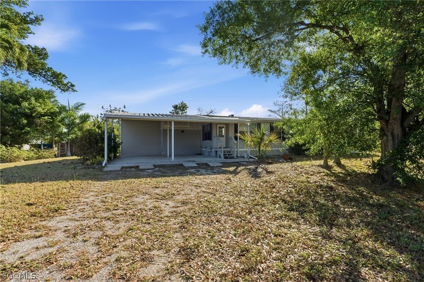 Welcome to the laid-back charm of Pine Island living! Nestled on - photo 4