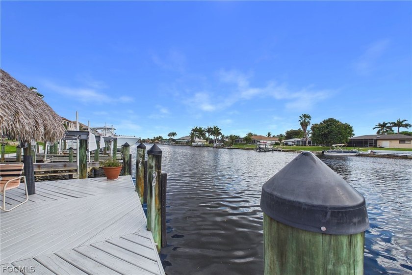 MOTIVATED SELLER! Welcome to your dream waterfront escape. This - photo 2