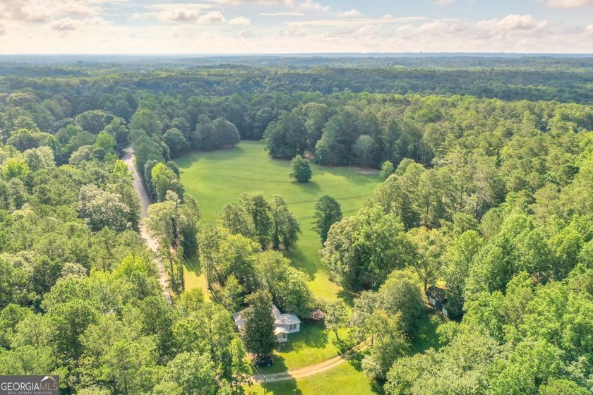 Zoned R-2, the property allows for one home per half-acre and - photo 2