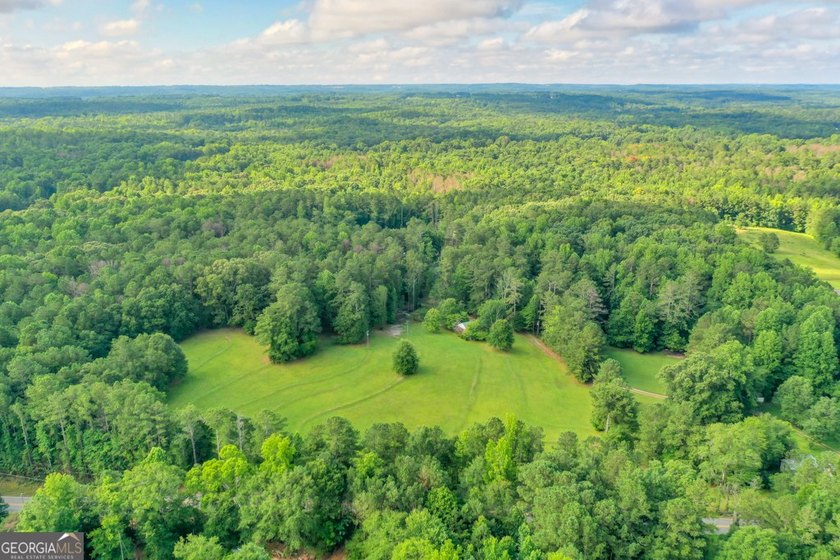 Zoned R-2, the property allows for one home per half-acre and - photo 3