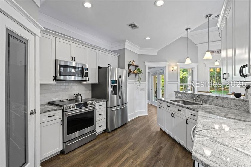 On a generous 0.63-acre corner lot in golf cart-friendly - photo 3