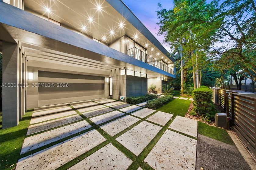 Stunning Coconut Grove residence showcasing soaring ceilings and - photo 3