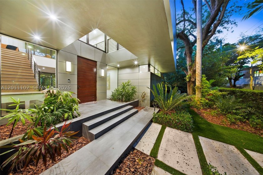 Stunning Coconut Grove residence showcasing soaring ceilings and - photo 6