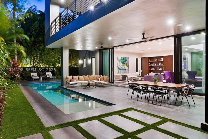 Stunning Coconut Grove residence showcasing soaring ceilings and - photo 9