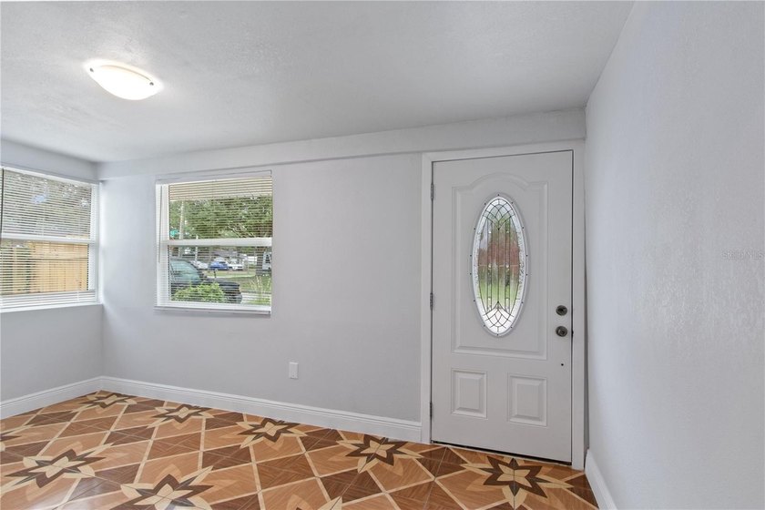 This meticulously renovated property features a new, detached - photo 3