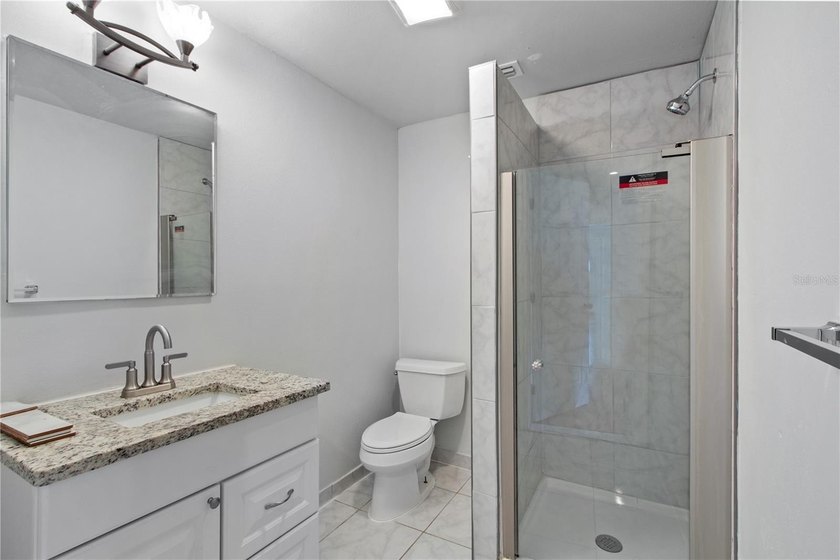 This meticulously renovated property features a new, detached - photo 9