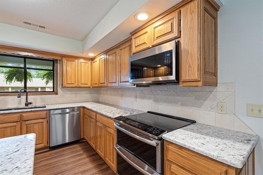 Lake area living at its very best in this lovely home with - photo 11