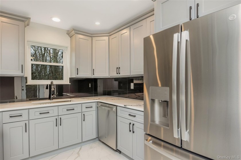 Welcome to this beautifully renovated 4-bedroom, 2.5-bath home - photo 11