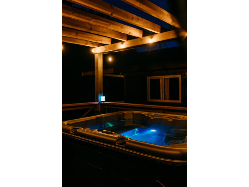 Tucked away on 2 private acres among the trees, *Simmer Down* is - photo 3