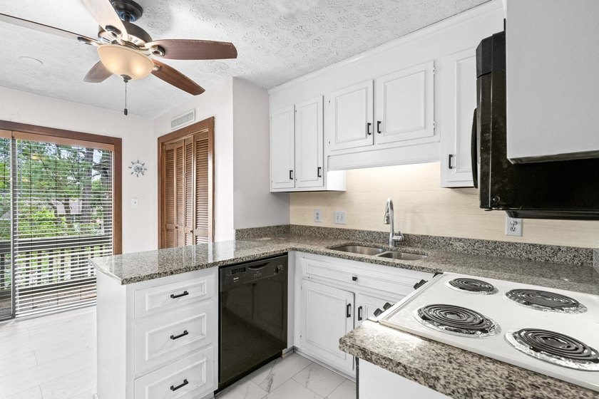 Unit 301 at Spinnaker's Reach is a spacious top-floor condo - photo 10