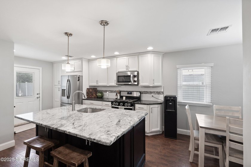 This beautifully updated 4 bed 2 bath sprawling ranch is - photo 8
