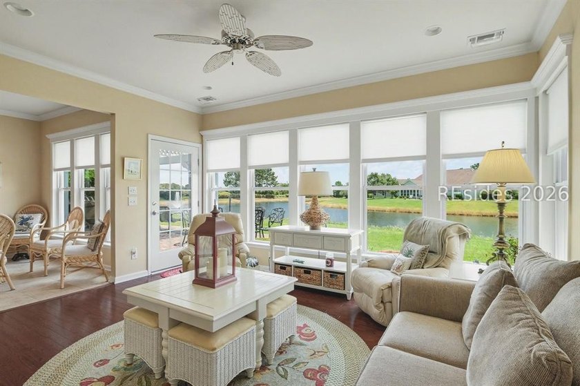 Set on a large premium lot with peaceful lagoon views, timeless - photo 2