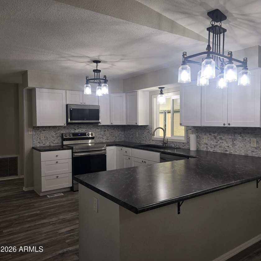 ON LEASED LAND: This home is absolutely gorgeous!! It has been - photo 15