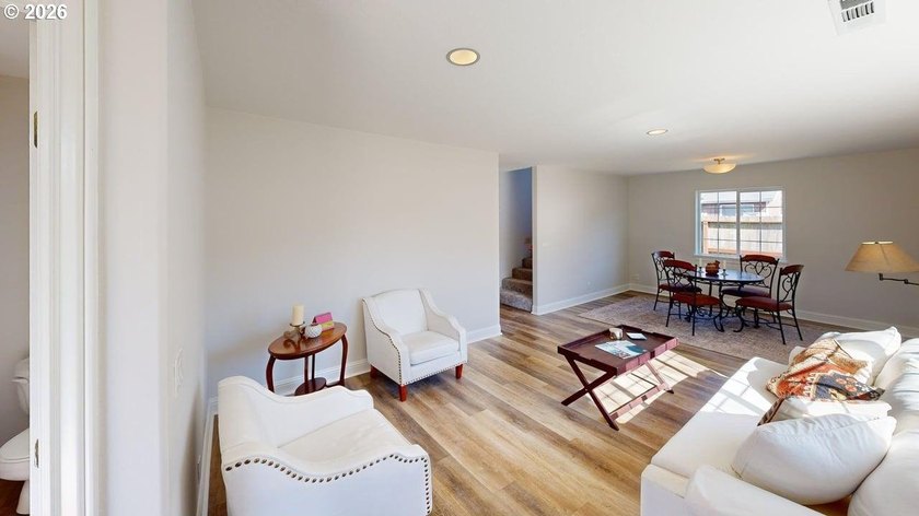 Three bedrooms and a spacious two-level layout set the tone for - photo 2
