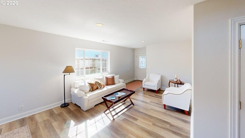 Three bedrooms and a spacious two-level layout set the tone for - photo 3